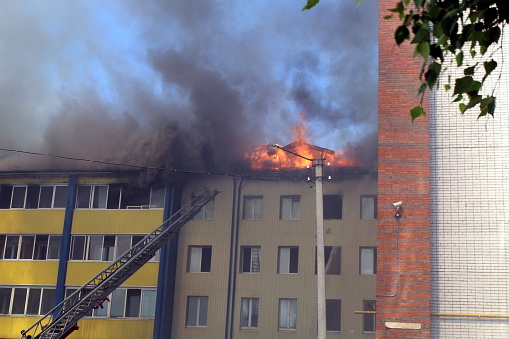Fire in a high-rise building in the summer.