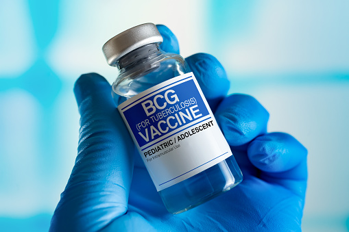 Vaccination for booster shot for BCG Bacillus Calmette Guerin against tuberculosis in the children and adolescents. Doctor with vial of the doses vaccine for BCG against tuberculosis disease
