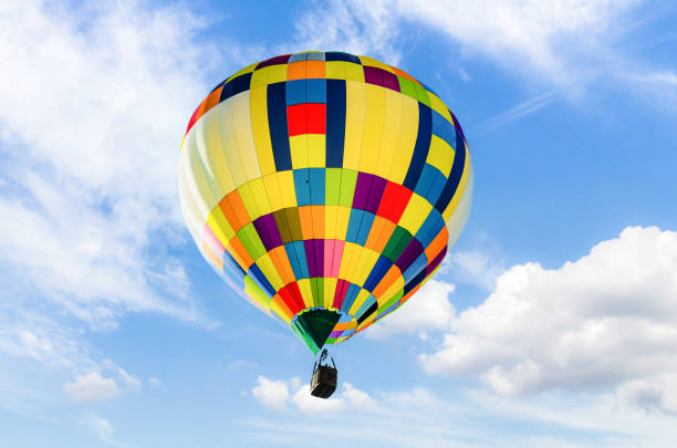 istock Hot air balloon flight over blue sky 1387330989