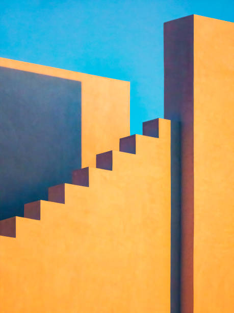 Minimalist contemporary design of Gulf Coast building Three plain exterior walls, one with steplike zigzag, of a large building in New Urbanist architectural style, at sunset in a coastal beach town in northwest Florida new urbanism stock pictures, royalty-free photos & images