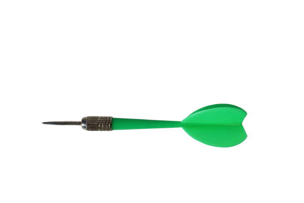 istock One green dart lies on a white background. 1387333342