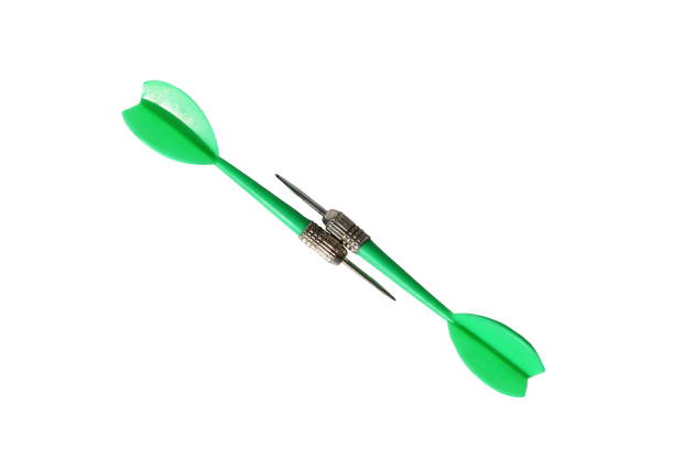istock Two green darts for darts lie on a white background. 1387333449