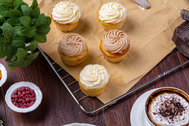 istock Freshly baked cupcakes with coffee and small forest fruits 1387334225