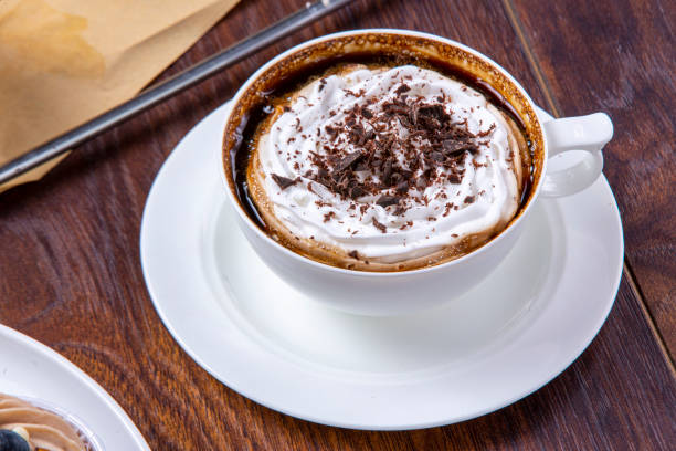 istock Coffee covered with cream and grated chocolate 1387334235