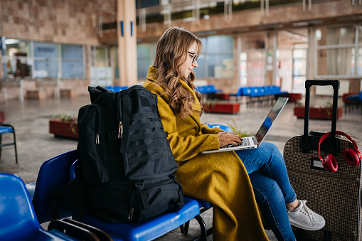 Cheerful Blond Girl Using Laptop