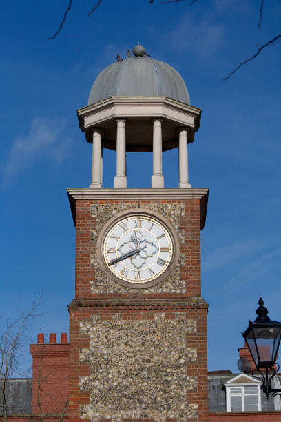 istock Ornate flint decorated Town clock with domed roof 1387337817