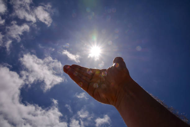 istock Hand over the Sky and Sun 1387339314