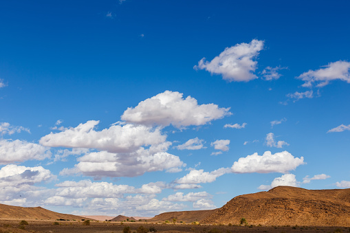 White clouds in the blue sky. Sahara Desert. Sky And Desert