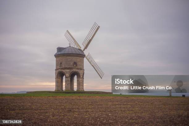 Rural Windmill At Sunset Stock Photo - Download Image Now - Agricultural Activity, Agricultural Field, Agriculture