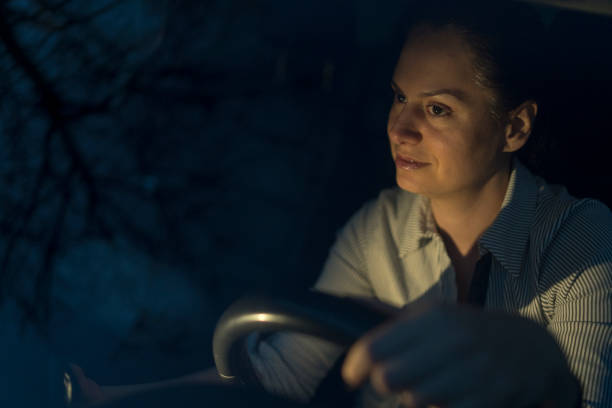 istock Young woman driving a car 1387342923