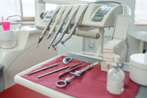 Close-up photo of dentist tools, equipment, and utensils for health care and teeth care.