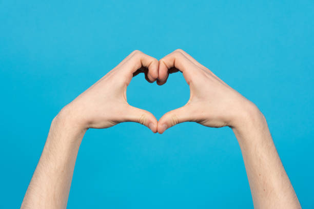 istock Love sign on blue background 1387344393