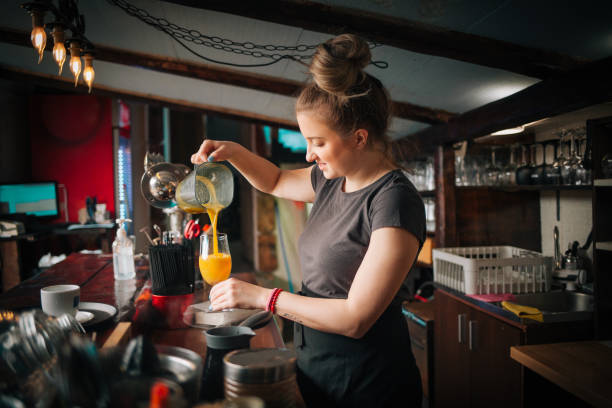 istock Woman Barista at work 1387345346
