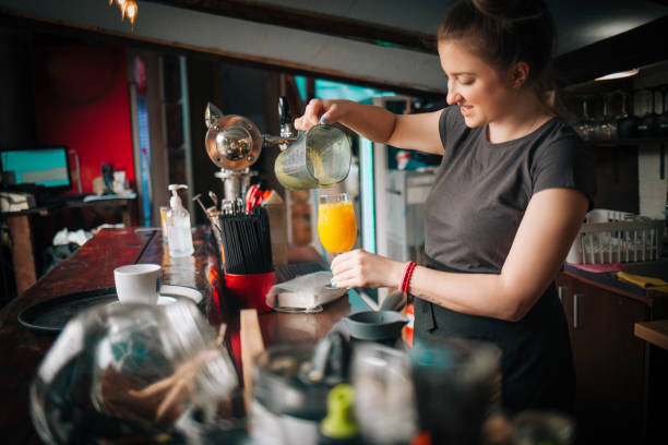 istock Woman Barista at work 1387345402