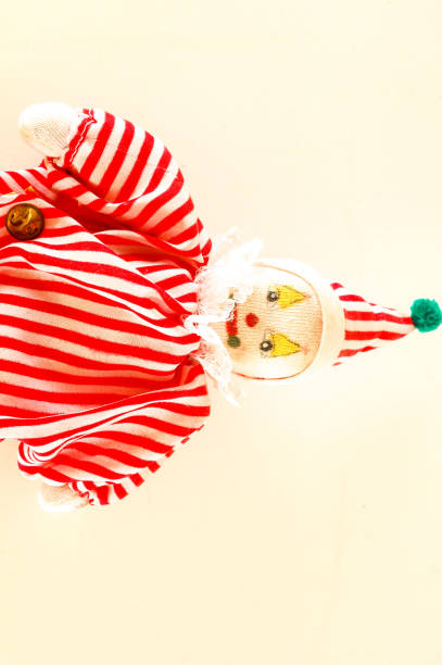 istock Pierrot toy doll on white background 1387346832