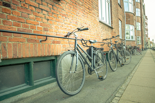 Bicycles can be parked anywhere, leaning against a wall in Christiania, Copenhagen