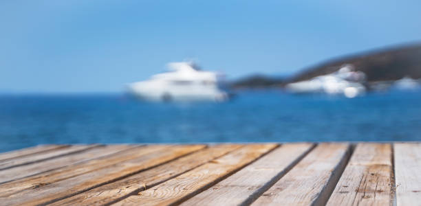 istock Empty wooden deck on the background of a white yacht. 1387351864