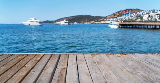 istock Empty wooden deck on the background of a white yacht. 1387352084
