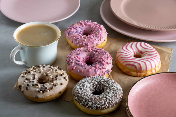 istock Several donuts lie on craft parchment paper on gray surface 1387352274