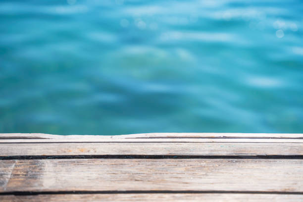 istock Empty wooden deck with the sea in the background. 1387352277