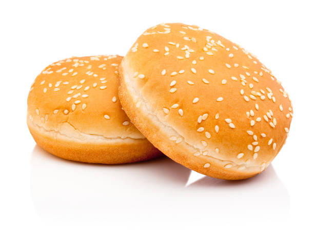 istock Two hamburger buns with sesame isolated on white background 1387352879