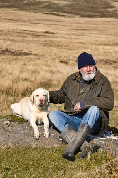 istock Old man and his dog on the Moors 1387352982