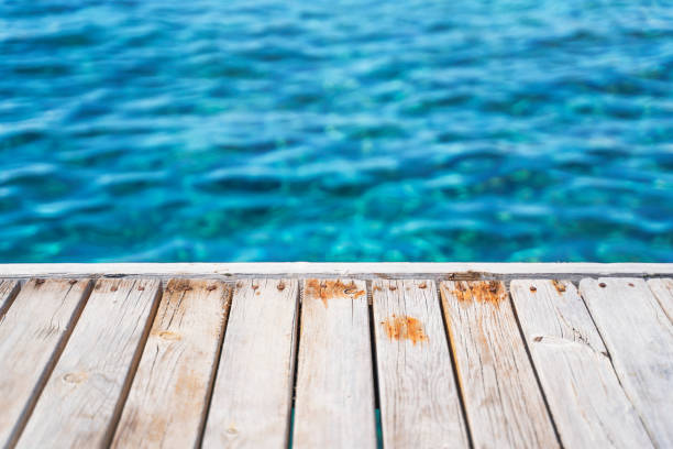 Empty wooden deck with the sea in the background. . High quality photo