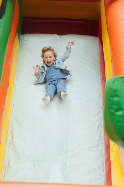 children on an active walk - inflatable child jumping leisure games imagens e fotografias de stock