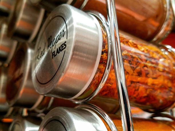 istock Bottle of Red Pepper Flakes Close-up 1387354331