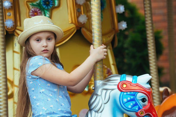 istock children have fun in the amusement park 1387356520