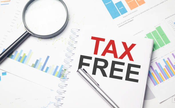 istock tax free, text on notepad on gray background near keyboard 1387357331