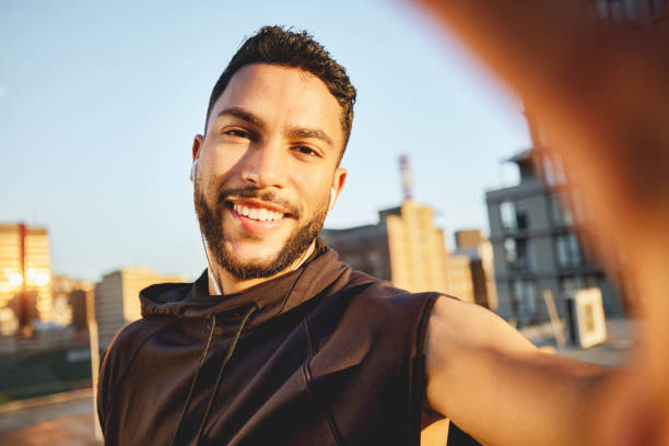 istock Shot of a young man taking a selfie while out for a workout 1387358741