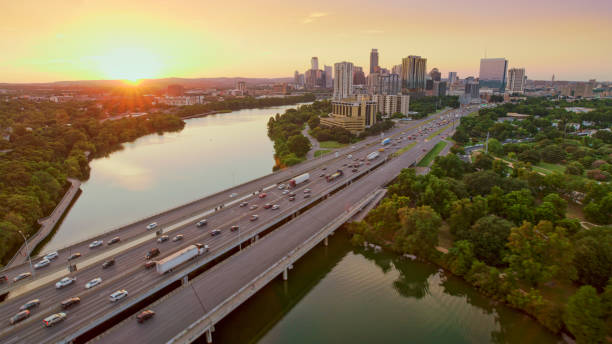 Bridge Over Colorado river Aerial view of bridge over Colorado river in Austin, Texas, USA. austin texas traffic stock pictures, royalty-free photos & images