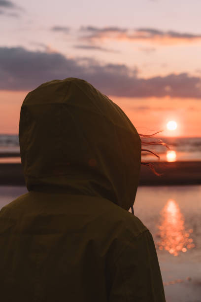 close up woman on the sunset coast - sea zen like landscape water imagens e fotografias de stock