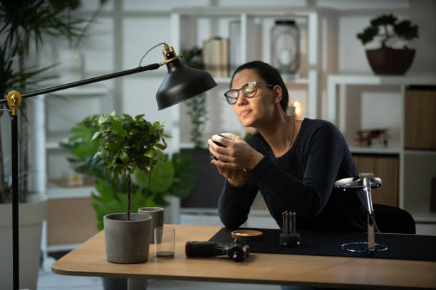 istock Photographic lens repair 1387362098