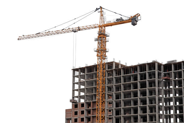 istock Construction yellow crane and gray frame of new multi-storey building on a white background 1387363293