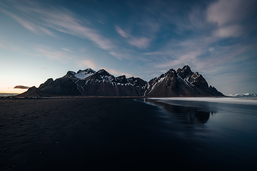 Vestrahorn Mountain Range Panorama, Stokksnes, Southeast Iceland. Volcanic Black Beach at Vestrahorn Mountain in Winter. Beautiful Black Beach and Sea and iconic Mountain Range. Winter Skyscape. Stiched <drone Point of View Panorama. Vestrahorn Mountain Range, Stokkness, South East Iceland, Nordic Countries, Northern Europe.