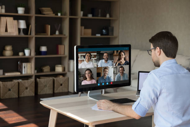istock Focused young businessman holding video call conversation. 1387372791
