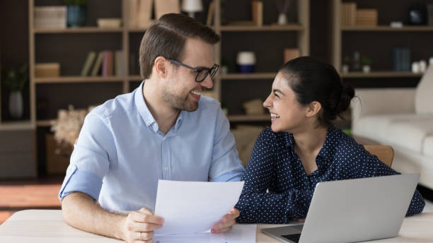 istock Joyful young multiracial employees feeling satisfied with good results. 1387372801