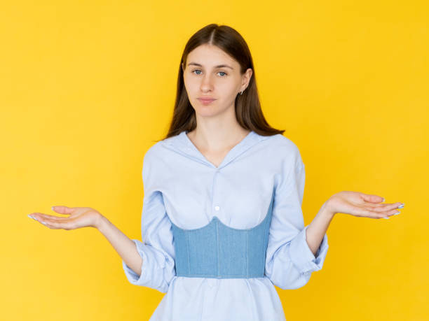 istock hesitating woman helpless feelings unsure look 1387373068