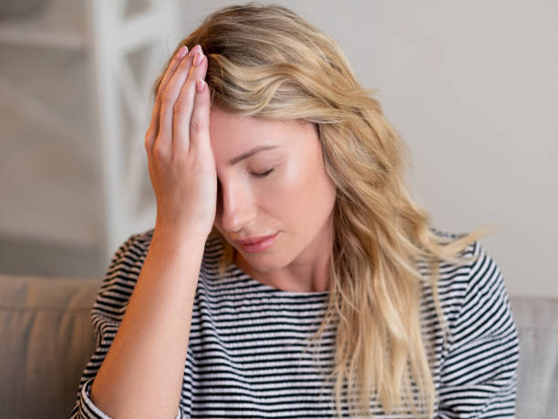 istock fail depression desperate woman headache suffer 1387373095