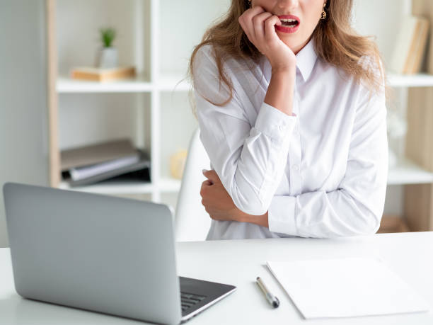 istock worried office woman work difficulties bad news 1387373103