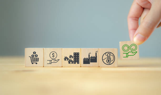 istock Circular economy concept. Business and environment sustainable. Climate changing problem solving goal.
Putting smart flat wooden cube with sustainability and pollution sources icon on grey background. 1387376323