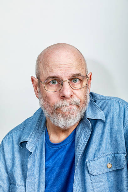 istock Serious Senior Man Chewing Lip 1387377029