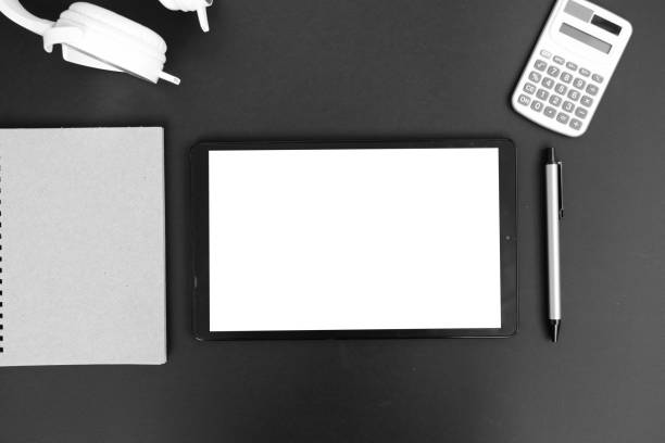 Tablet on the desk office and technology, Top view on working space with office equipment and space for text