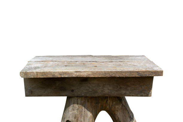 istock Old wooden table made of split planks on white background. 1387383674