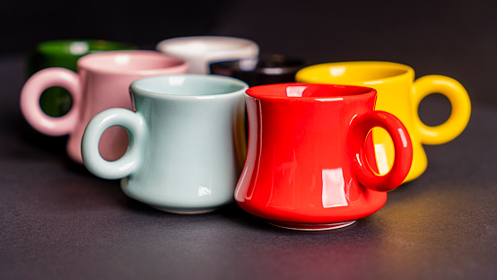 Colorful coffee cup black background