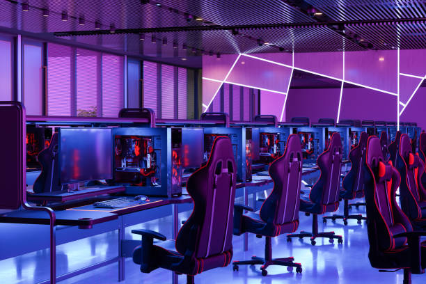 Esports Video Gaming Studio With Computers, Gaming Chairs And Neon Lighting Esports Video Gaming Studio With Computers, Gaming Chairs And Neon Lighting gaming chair photos stock pictures, royalty-free photos & images