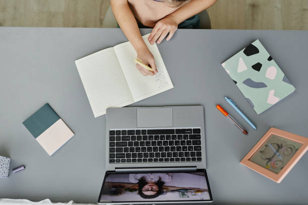 istock Child Watching Online Lesson Top View 1387407087
