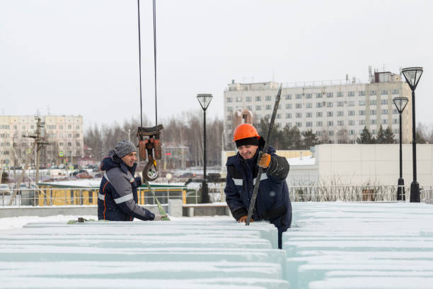 istock An assembly worker tries to push the ice slabs apart with a crowbar 1387410168